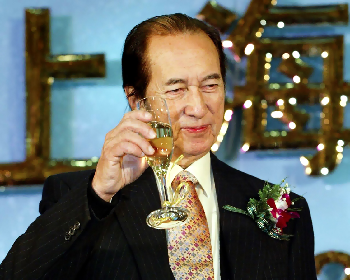 Macau gambling King Stanley Ho drinks champagne Gambling magnate Stanley Ho with a glass of champagne in his hands